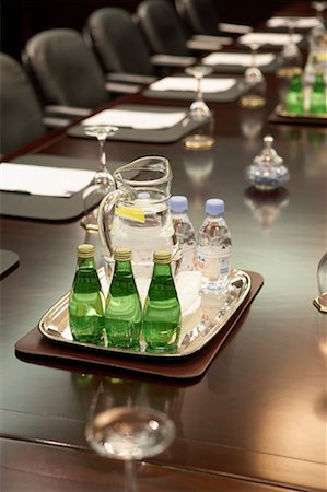 Custom Labeled Water Bottles in Company Board Room on meeting table.